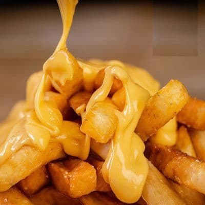 Papas fritas al cheddar