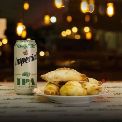 1 Docena de Empanadas + 1 Cerveza Rubia 710 cm3